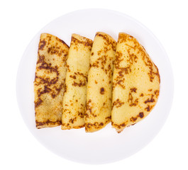 Crispy thin pancakes on plate, light background