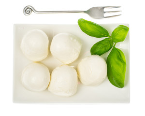 Mozzarella balls on white plate
