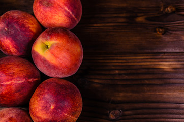 Fresh ripe peaches on wooden table. Top view