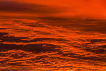 Fototapeta na wymiar Red voluminous clouds at sunrise