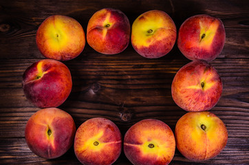 Fresh ripe peaches on wooden table. Top view