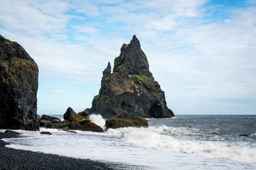 Black sand beach, Reynisfjara shore near the village Vik, atlantic ocean, Iceland