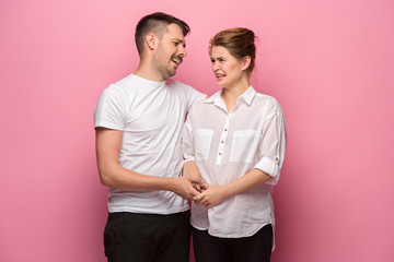 The funny handsome man and his beautiful pregnant wife's tummy