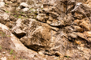Stone cliffs in the mountains as a background