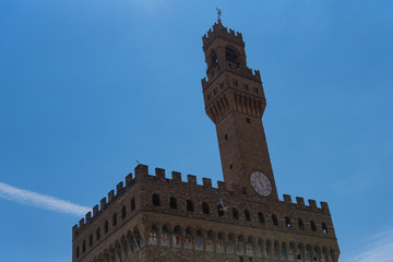 Fototapeta premium Detail of Facade of Old Palace called Palazzo Vecchio at the Piazza della Signoria in Florence, Tuscany, Italy