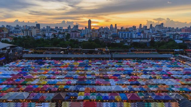 Day to night time lapse of Top view of Canvas tent at the outdoor market