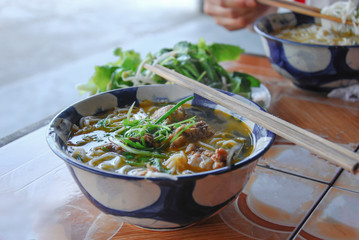  Pho is a Vietnamese noodle soup consisting of broth, rice noodles and meat, primarily made with either beef or chicken.