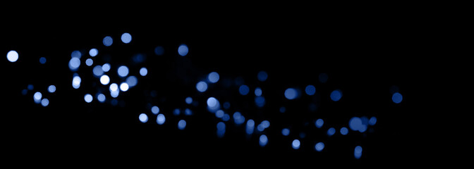 Abstract dark background with blue bokeh effect