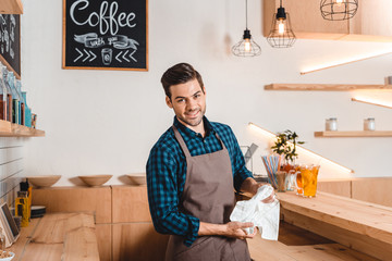 smiling barista in coffee shop