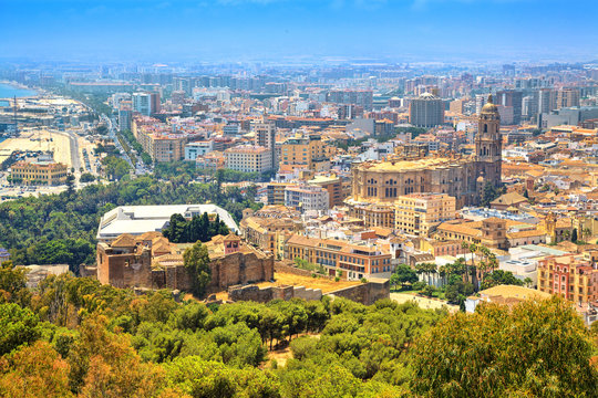 Cityscape panoramic aerial view of Malaga with bullring and harbor. Port of malaga, alcazaba castle and the cathedral of malaga. Spain.