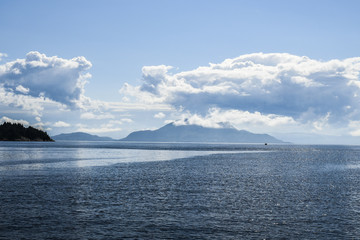 Fototapeta na wymiar Beautiful landscape on the north sea in norway with clouds on a sunny day