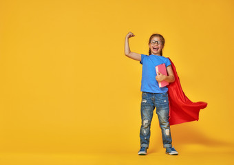 child plays superhero