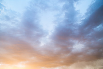 Naklejka na ściany i meble Clouds at sunset as background