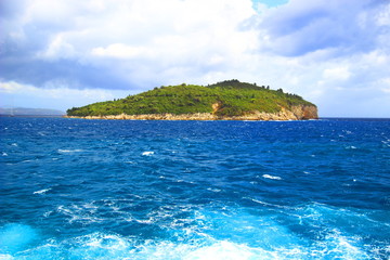 Fototapeta na wymiar Lokrum island and rough sea near Dubrovnik, touristic destination in Croatia