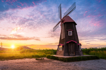 Fototapeta premium Korea landscape Beautiful sunset and traditional windmills, incheon South Korea, Sorae ecology wetland park
