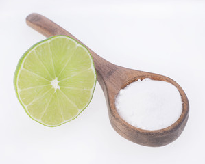 Baking soda and lemon on white background