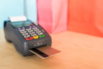 close-up view of POS terminal with credit cards
