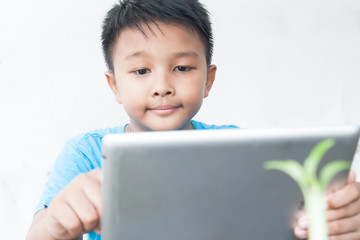 Asian boy using tablet, Happy lifestyle with technology