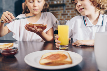 close-up shot of happy kids having breakfast before school