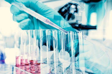 Double exposure of science experiment  hand holding test tube in the laboratory