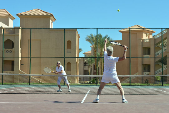 Couple Playing Tennis