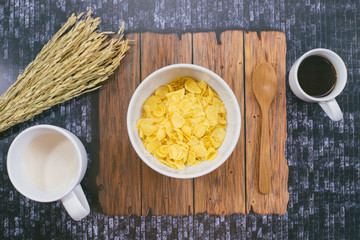 Time to breakfast with milk, coffee and corn flakes