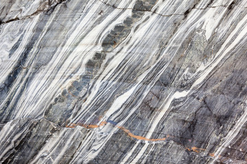 Fototapeta premium Stone background closeup texture. Focus on the pattern of the surface.