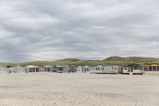 Beach at Wijk aan Zee in the netherlands. Little beach houses at the foot of the dunes.