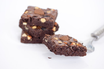 Brownie stack, closeup chocolate cake  on white background