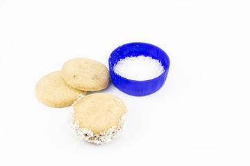 Alfajor of cornstarch, dulce de leche and grated coconut.