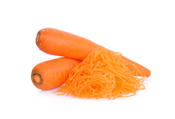 Pile of shredded carrots and two whole carrots isolated on white background