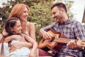 Fototapeta premium Young family enjoying quality time