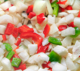 Onion, red and green peppers frying the wok. Preparing food.