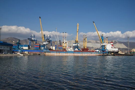 International sea port of Novorossiysk. Port cranes, ships and industrial objects