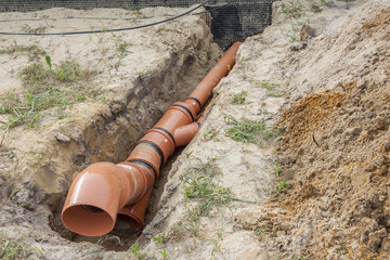 Construction site - orange waste pipe
