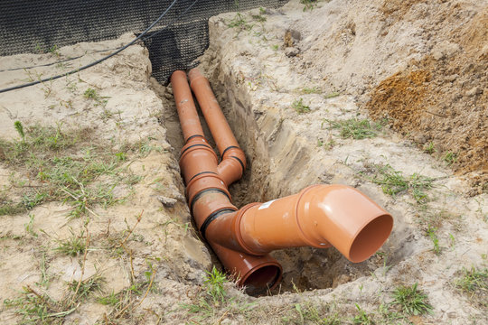 Construction site - orange waste pipe
