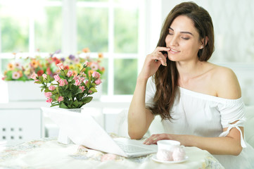 young woman using laptop