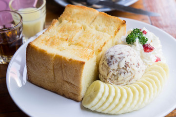 Toast and ice cream and banana dessert in cafe