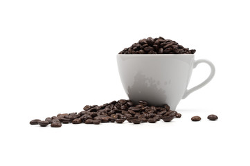 Roasted coffee beans in a cup of coffee