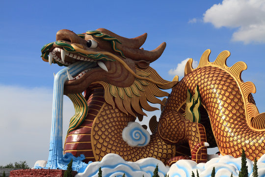 dragon statue on blue sky