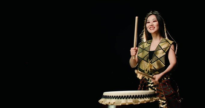epic performance beautiful Asian girl drummer Taiko , makes the rhythm, Slow motion