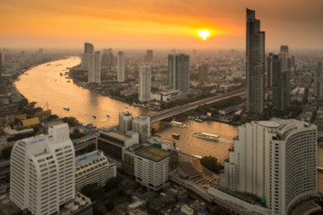 Bangkok skyline with curve of Chao Phraya river view while sunset as abstract style.