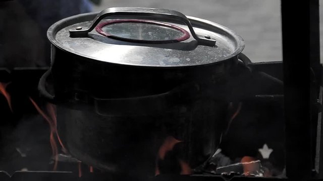 Cooking food in nature on the pot.