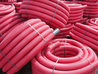Red corrugated plastic pipes used for underground electrical lines