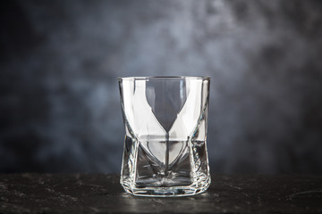 Empty glass on dark background