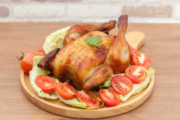  roast chicken on wooden plate