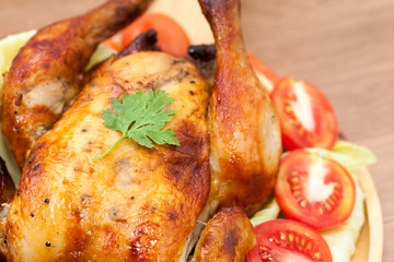  roast chicken on wooden plate