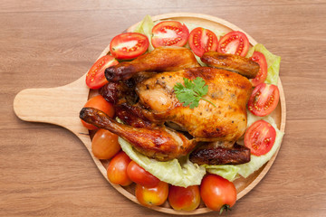  roast chicken on wooden plate