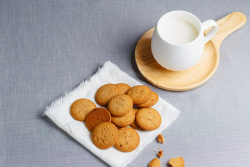 cookies and milk on gray cloth background