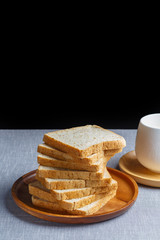 Whole Wheat Bread and milk on gray cloth